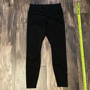 Nike women’s legging size Large. Nike Check on left lower leg is partially off